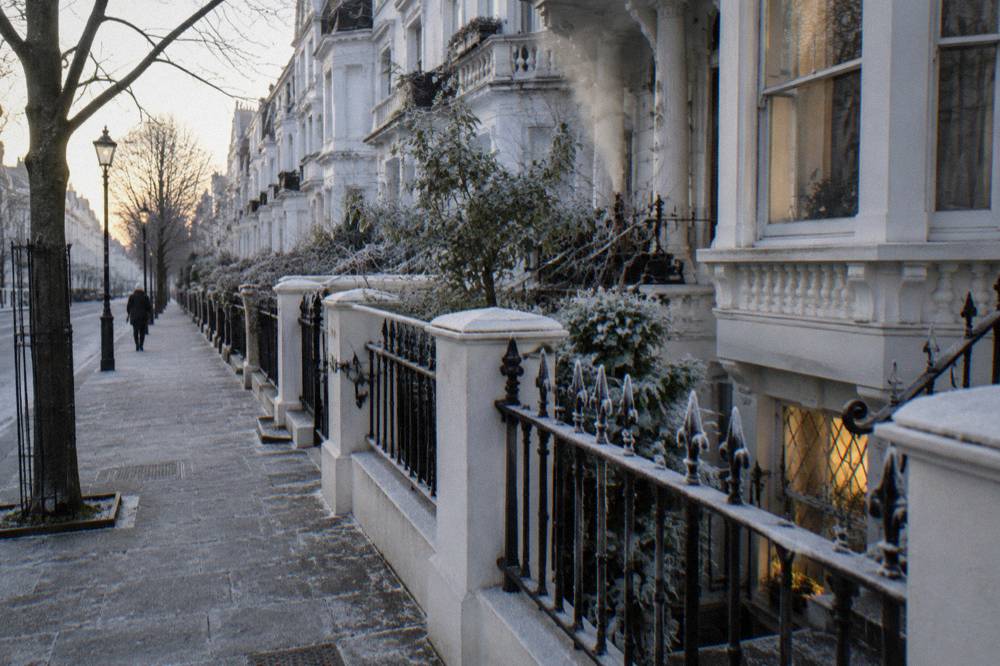 A Victorian terrace street in London with white stucco facades