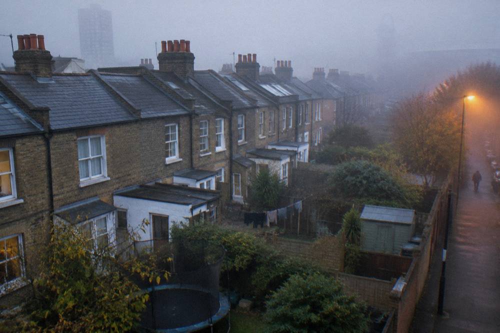Rows of brick terraced houses in East London seen from above with small back gardens