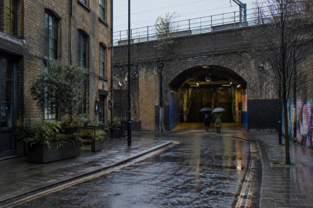 A London Overground station entrance on a quiet street in east London