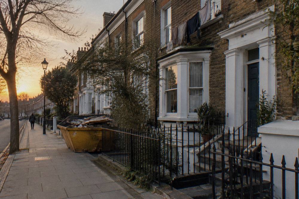 A residential London street with terraced brick houses