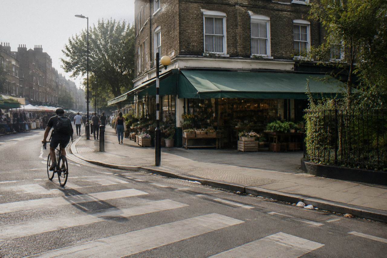 A London street with brick terraces and a tube station entrance